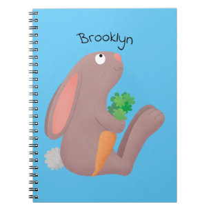 Cute bunny rabbit sitting with carrot cartoon notebook