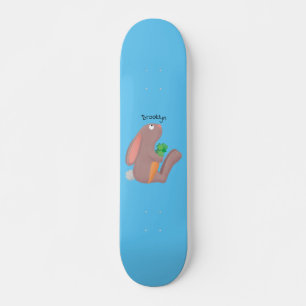 Cute bunny rabbit sitting with carrot cartoon skateboard