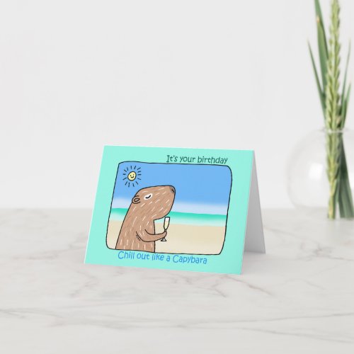 Cute Capybara chilling out on beach happy birthday Card
