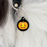Cute Cartoon Halloween Jack O’Lantern Pumpkin Pet ID Tag<br><div class="desc">Cool cartoon illustration of an orange Jack O’Lantern pumpkin with a happy face expression. The background color is black. On the other side there are personalizable text areas for a phone number and for the name of the pet.</div>