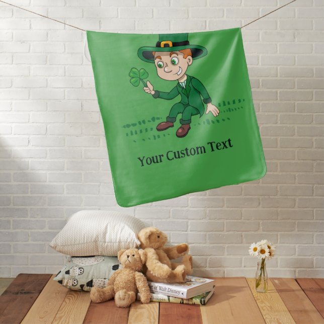 Cute cartoon leprechaun with shamrock and rainbow baby blanket (In Situ)