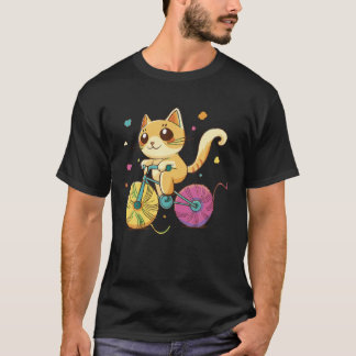 Cute cat riding a bike with balls of wall as its w T-Shirt