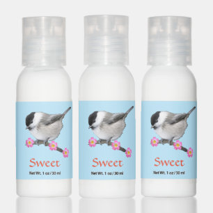 Cute chickadee bird and pink flowers on light blue hand lotion