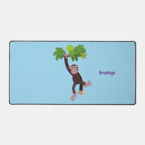 Cute chimpanzee in jungle hanging cartoon desk mat