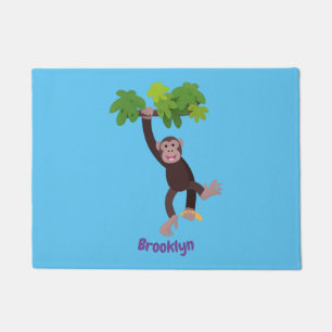 Cute chimpanzee in jungle hanging cartoon doormat