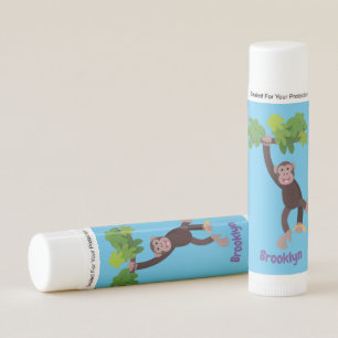 Cute chimpanzee in jungle hanging cartoon lip balm