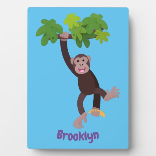 Cute chimpanzee in jungle hanging cartoon plaque