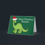 Cute Christmas Dinosaur in Santa Hat Custom Green Card<br><div class="desc">Awesome green dinosaur smiling and looking very cute in a holiday red Santa hat. Kids will love this cool green holiday card. Customize these Christmas cards with your own text in white.</div>
