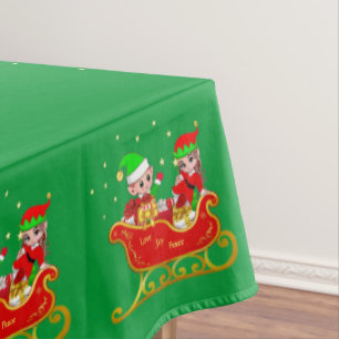 Cute Christmas elves on sleigh on green Tablecloth