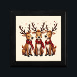 Cute Christmas Reindeer Trio with Plaid Scarves Gift Box<br><div class="desc">This charming Christmas design features an adorable trio of cartoon-style reindeer, each with expressive eyes, cozy red and black buffalo plaid scarves, and majestic antlers that stretch playfully into the night sky. The whimsical reindeer are arranged in a heartwarming pose against a festive backdrop of scattered gold and red stars,...</div>