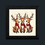 Cute Christmas Reindeer Trio with Plaid Scarves Gift Box<br><div class="desc">This charming Christmas design features an adorable trio of cartoon-style reindeer, each with expressive eyes, cozy red and black buffalo plaid scarves, and majestic antlers that stretch playfully into the night sky. The whimsical reindeer are arranged in a heartwarming pose against a festive backdrop of scattered gold and red stars,...</div>