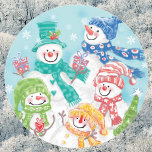 Cute Christmas Snowman Family in the Snow Classic Round Sticker<br><div class="desc">Vintage illustration Merry Christmas holiday design featuring an adorable cartoon happy snowman family with mom, dad and the snow children. Everyone is smiling and wearing a scarf and holding Christmas presents and a Christmas tree. It is snowing with large snowflakes falling. Their scarves and hats are all different colors, red,...</div>