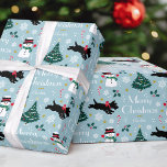 Cute Christmas Tree Snowman Scottie Dog Blue Wrapping Paper<br><div class="desc">Add a little whimsical charm to the holiday season with this cute Christmas gift wrap! Featuring original artwork with a happy snowman wearing a hat, scarf and mittens, a festive Scottie dog with a red bow, a Christmas tree, candy canes, holly, snowflakes and stars. The color palette includes red, green,...</div>