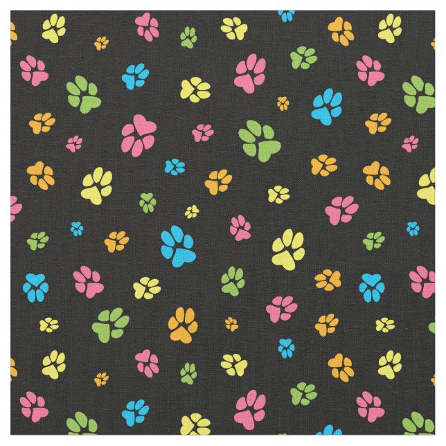 Cute colorful dog paw prints pattern on black fabric (Close Up)