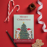 Cute Corgi Christmas Tree Dog in Santa Hat Custom Holiday Card<br><div class="desc">These beautiful Pembroke Welsh Corgi dogs have their heads tilted inside of a cute Santa Claus hat. The two pups are sitting in front of a pretty Christmas tree decorated with colorful ornaments. A lovely corgis holiday card with a wonderful drawing of a tricolor and a red and white corgi...</div>