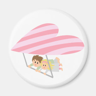 Cute couple flying on a heart-shaped hang-glider magnet