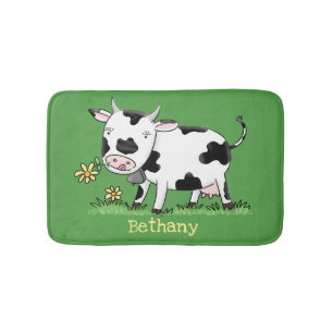Cute cow in green field cartoon illustration bath mat