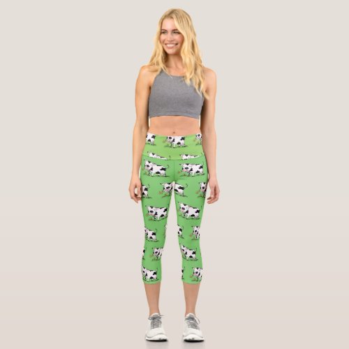 Cute cow in green field cartoon illustration capri leggings