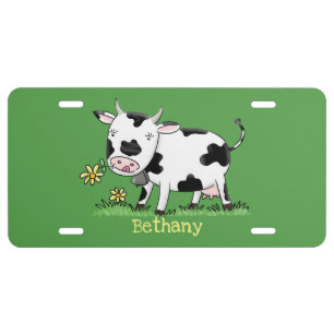 Cute cow in green field cartoon illustration license plate