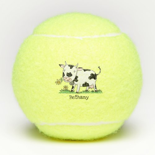 Cute cow in green field cartoon illustration tennis balls