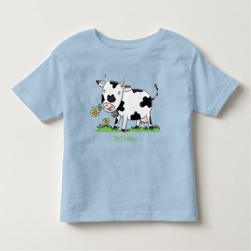 Cute cow in green field cartoon illustration toddler t_shirt