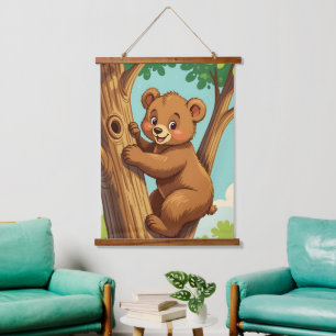 Cute cub bear climbing a tree hanging tapestry