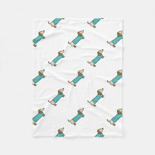 Cute dachshund in mint blue fleece blanket