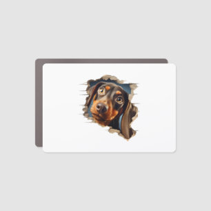 Cute dachshund puppy peeking in car magnet