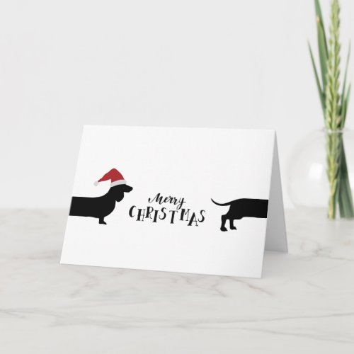 Cute dachshund with santa hat Merry Christmas Holiday Card