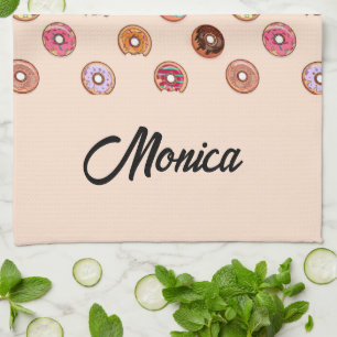 Cute decorative donuts on pink kitchen towel