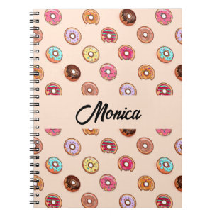 Cute decorative donuts on pink notebook