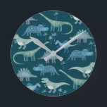 Cute Dinosaurs on Green Round Clock<br><div class="desc">Lots of blue dinosaurs,  Tyrannosaurus rex,  Spinosaurus,  Stegosaurus,  Diplodocus and Triceratops.</div>