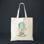 Cute Easter bunny in a hot balloon Tote Bag<br><div class="desc">Cute Easter bunny in a basket and a hot balloon.Happy Easter typography.</div>