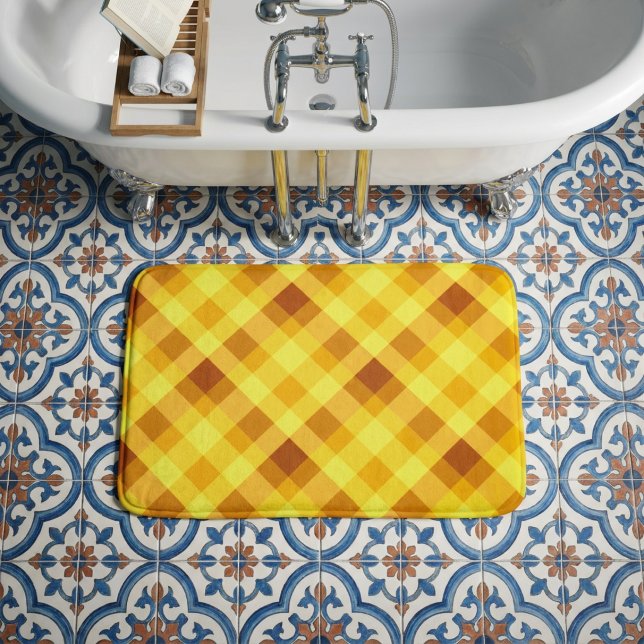 Cute Egg Yolk Yellow Plaid Small Bath Mat (Top down view of Cute Egg Yolk Yellow Plaid Small Bath Mat on tile floor in a bathroom.)