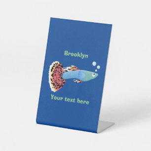Cute fancy guppy tropical fish cartoon pedestal sign