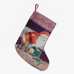 Cute father christmas wrapping gifts knitted small christmas stocking