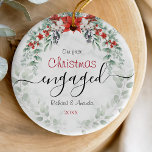 Cute first Christmas engagement red Poinsettia Ceramic Ornament<br><div class="desc">Celebrate your first holiday season as an engaged couple with this Cute First Christmas Engagement Red Poinsettia Ceramic Ornament. Featuring a vibrant red poinsettia surrounded by festive holiday accents, this ornament symbolizes love, joy, and the excitement of your engagement. Perfect for adding a cheerful and romantic touch to your Christmas...</div>