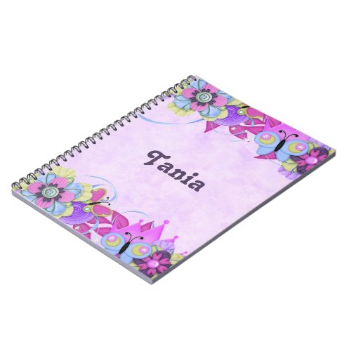 Cute flowers and butterflies on purple notebook