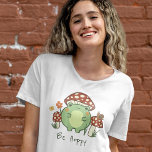 Cute Frog and Mushrooms Be Hoppy Cartoon  T-Shirt<br><div class="desc">This cute T-shirt features a hand-drawn kawaii style cartoon frog, wearing a mushroom hat, along with other mushrooms, a snail, a flower, a butterfly, and grass. A color scheme of red, lime, green, brown, orange, yellow, and peach is perfect for either the Indie or Cottage Core Aesthetic lover. Customize the...</div>