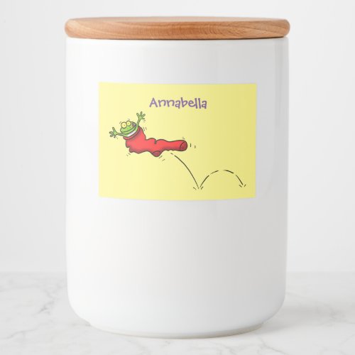 Cute frog in a red sock jumping cartoon food label