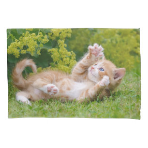Cute funny cat kitten playing in a flowery garden pillow case