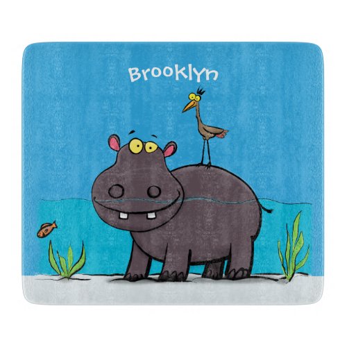 Cute funny hippopotamus with bird cartoon cutting board