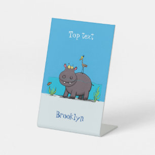 Cute funny hippopotamus with bird cartoon pedestal sign