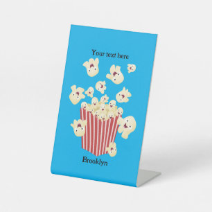 Cute funny jumping popcorn cartoon pedestal sign