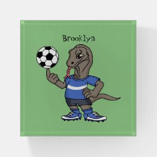 Cute funny Komodo dragon playing soccer cartoon Paperweight