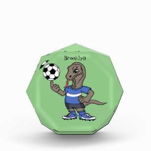 Cute funny Komodo dragon playing soccer cartoon Photo Block