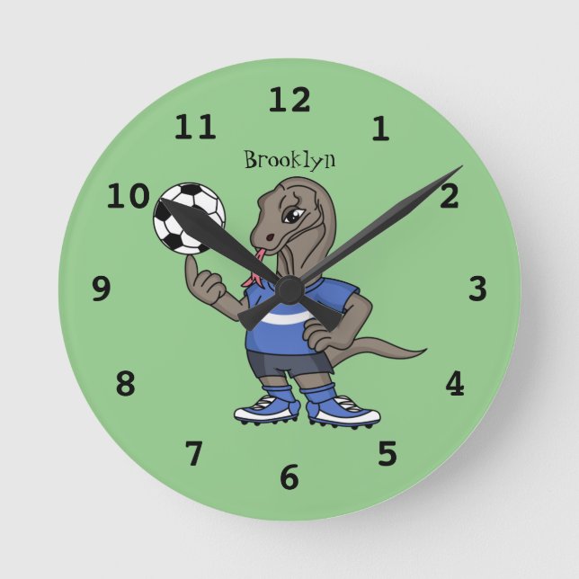 Cute funny Komodo dragon playing soccer cartoon Round Clock (Front)