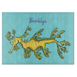 Cute funny leafy sea dragon cartoon illustration cutting board