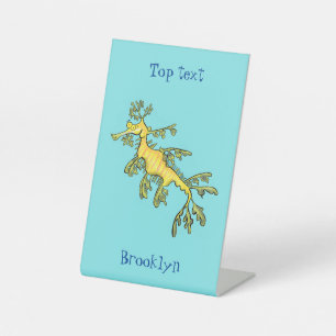 Cute funny leafy sea dragon cartoon illustration pedestal sign
