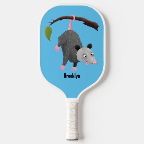 Cute funny opossum hanging from branch cartoon pickleball paddle
